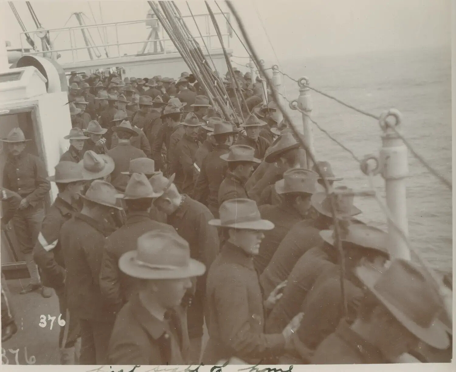 U.S. Army Soldiers Crowding the Deck of a Troop Transport, 'First Sight of Home,' c. 1899-1902