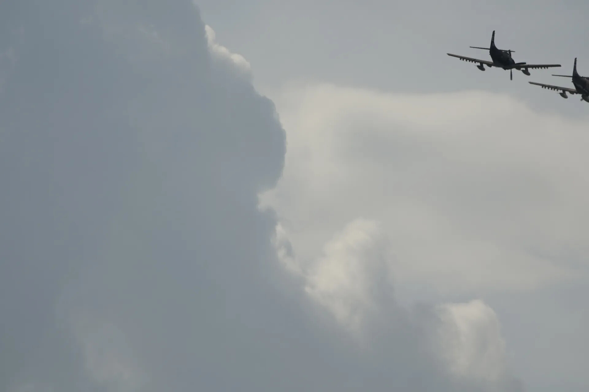 Formation of Two Propeller Warbirds Against Cloud Bank, 2019 Event
