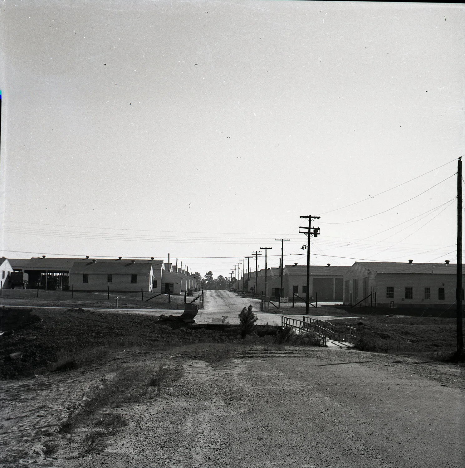 Row of Barracks Buildings and Utility Poles at a U.S. Military Training Installation, WWII Era