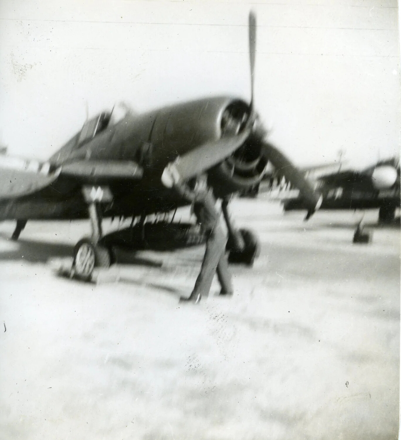 VMF-214 'Black Sheep' F4U Corsair on Airstrip with Ground Personnel, 1945 (Motion-Blurred Snapshot)