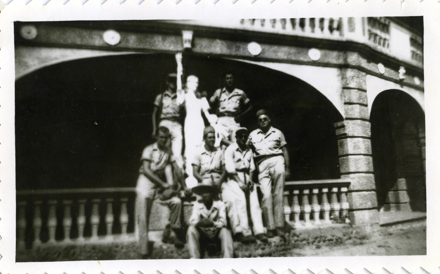 U.S. Servicemen Posed Around a Statue Beneath an Ornamental Stone Bridge, Pacific Theater, WWII Era