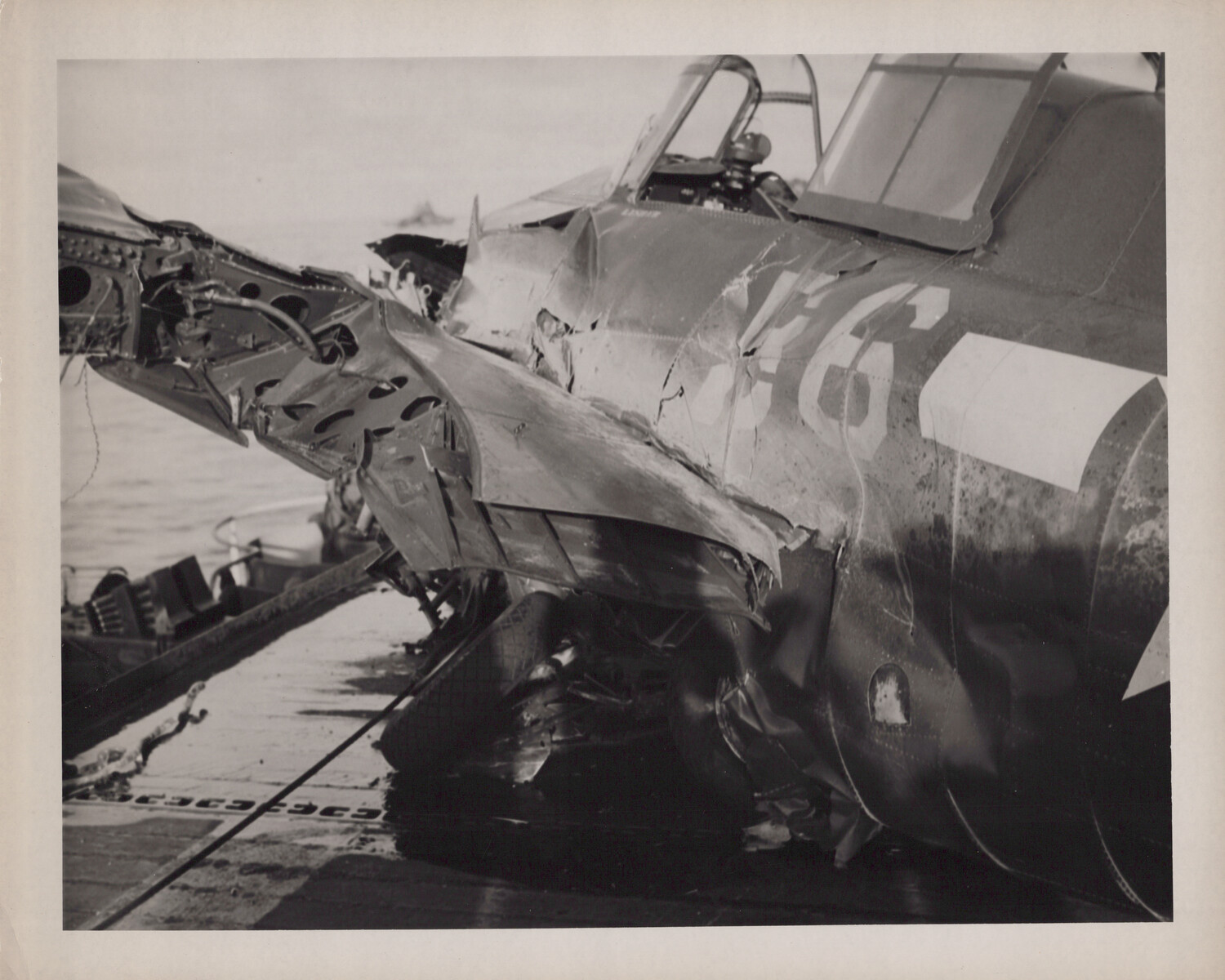 Crash-Damaged Carrier Fighter Aircraft on Flight Deck, USS Petrof Bay (CVE-80), WWII