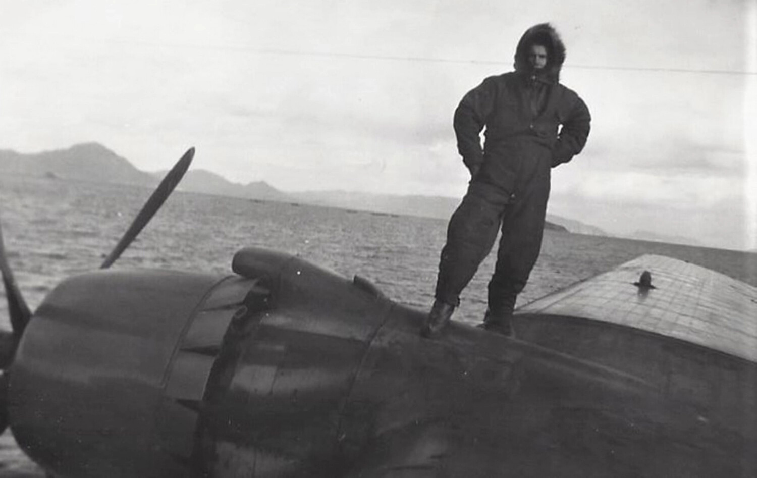 VP-47 Aircrewman in Cold-Weather Flight Suit on PBM Mariner Wing, Korean War Era