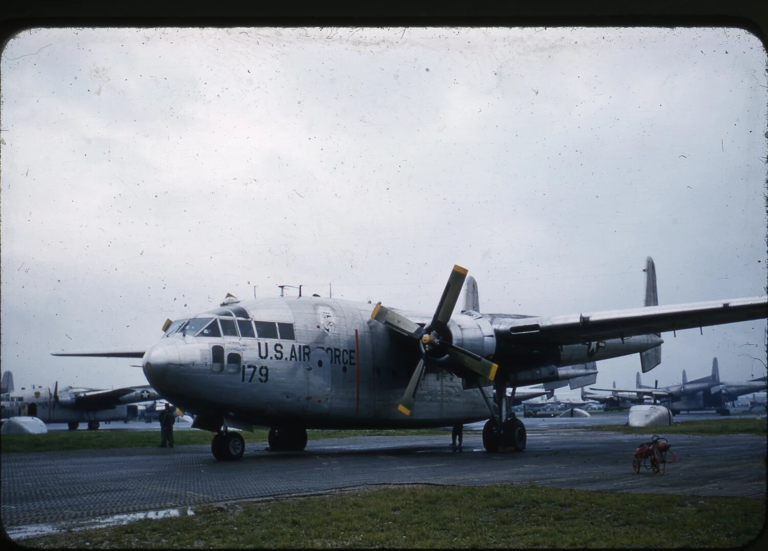 Fairchild C-119 'Flying Boxcar' No. 179 on Ramp with Ground Crew