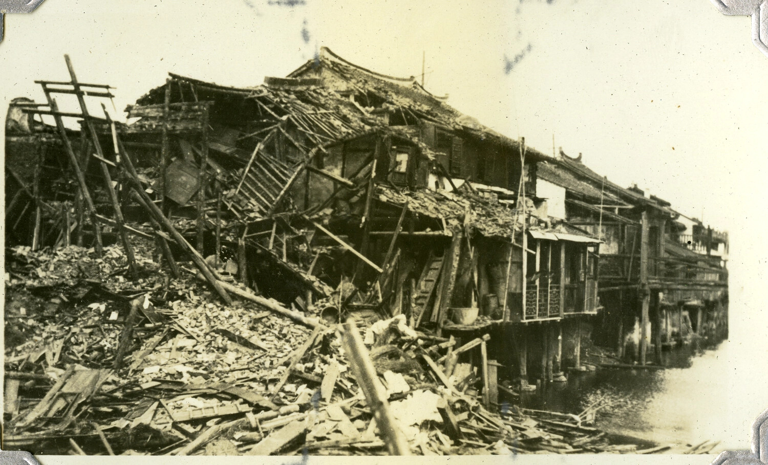 Ruins of a Riverside Building Complex, East Asia, Wartime Devastation, c. 1930s-1940s