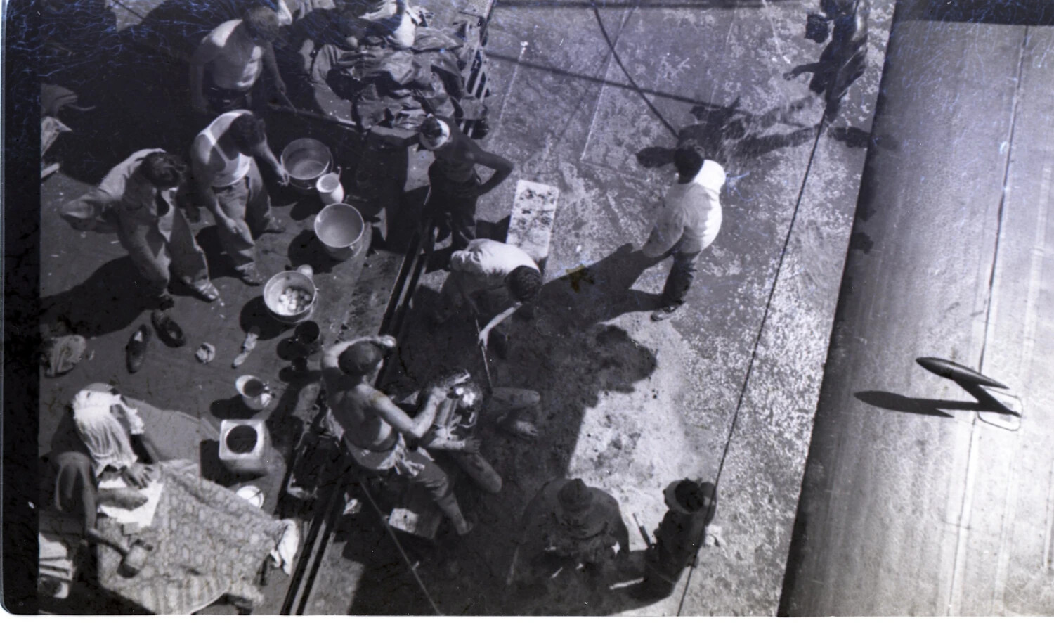 Overhead View of GIs at an Outdoor Washstand with Aircraft Shadow, CBI Theater, WWII