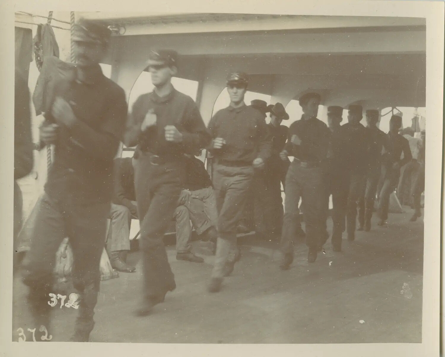 Soldiers Jogging in Formation on Deck of Troop Transport Ship