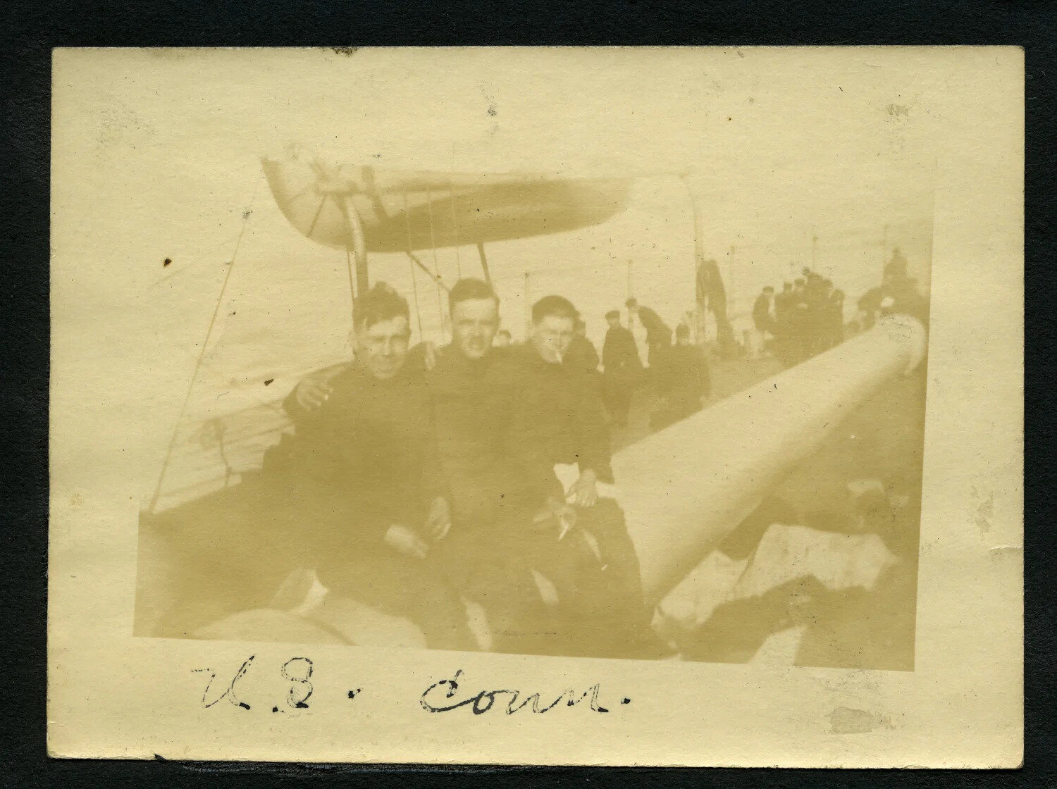 Sailors Posed by Ship's Boat and Deck Gun, "U.S. Conn." Album