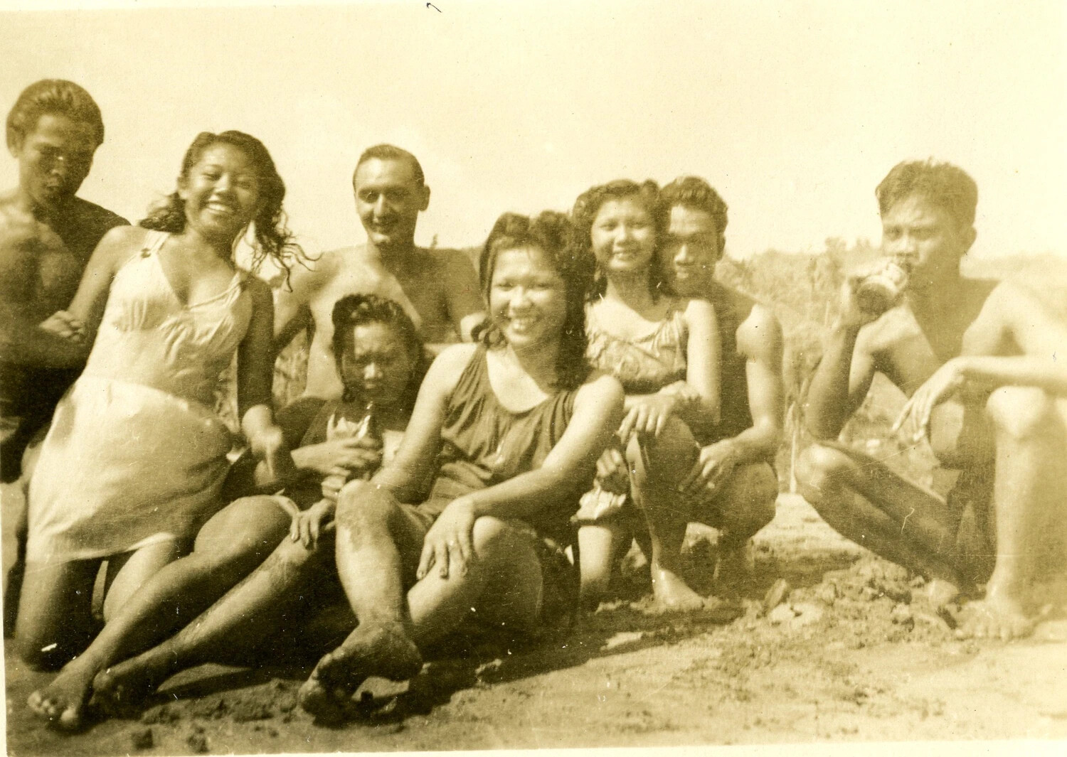 Group Portrait of Servicemen and Local Friends on the Beach, Pacific Theater, WWII Era