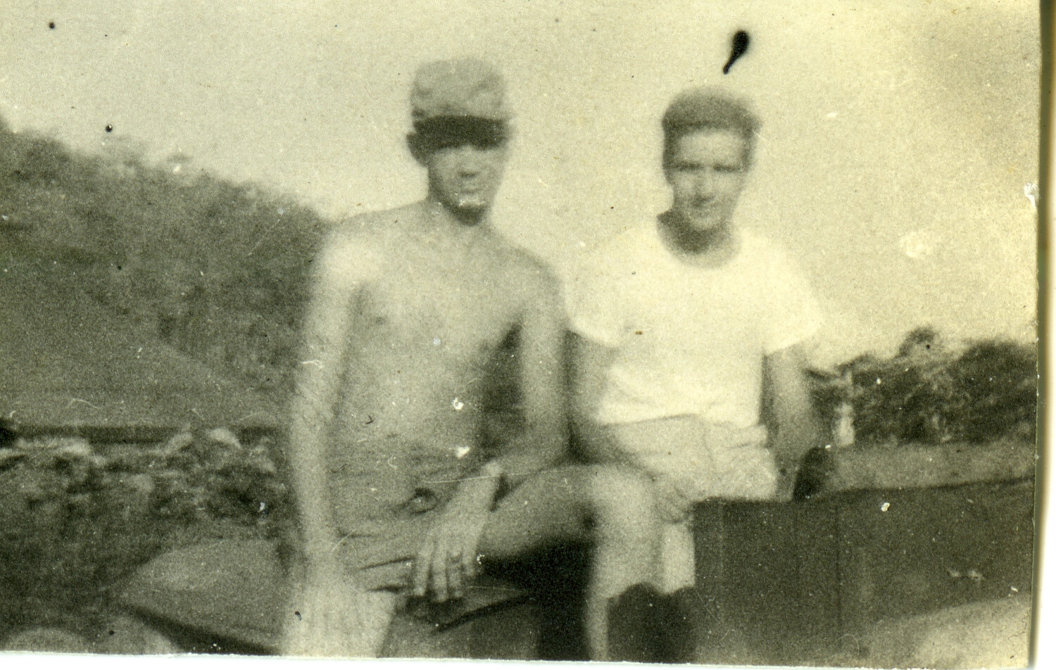 Two U.S. Servicemen Seated Outdoors, Pacific Theater, World War II