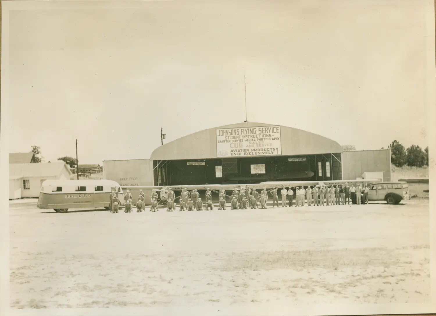 Group Photograph: Aviation Cadets and Flight Instructors, Johnson's Flying Service Hangar, Greenwood, South Carolina, circa 1943