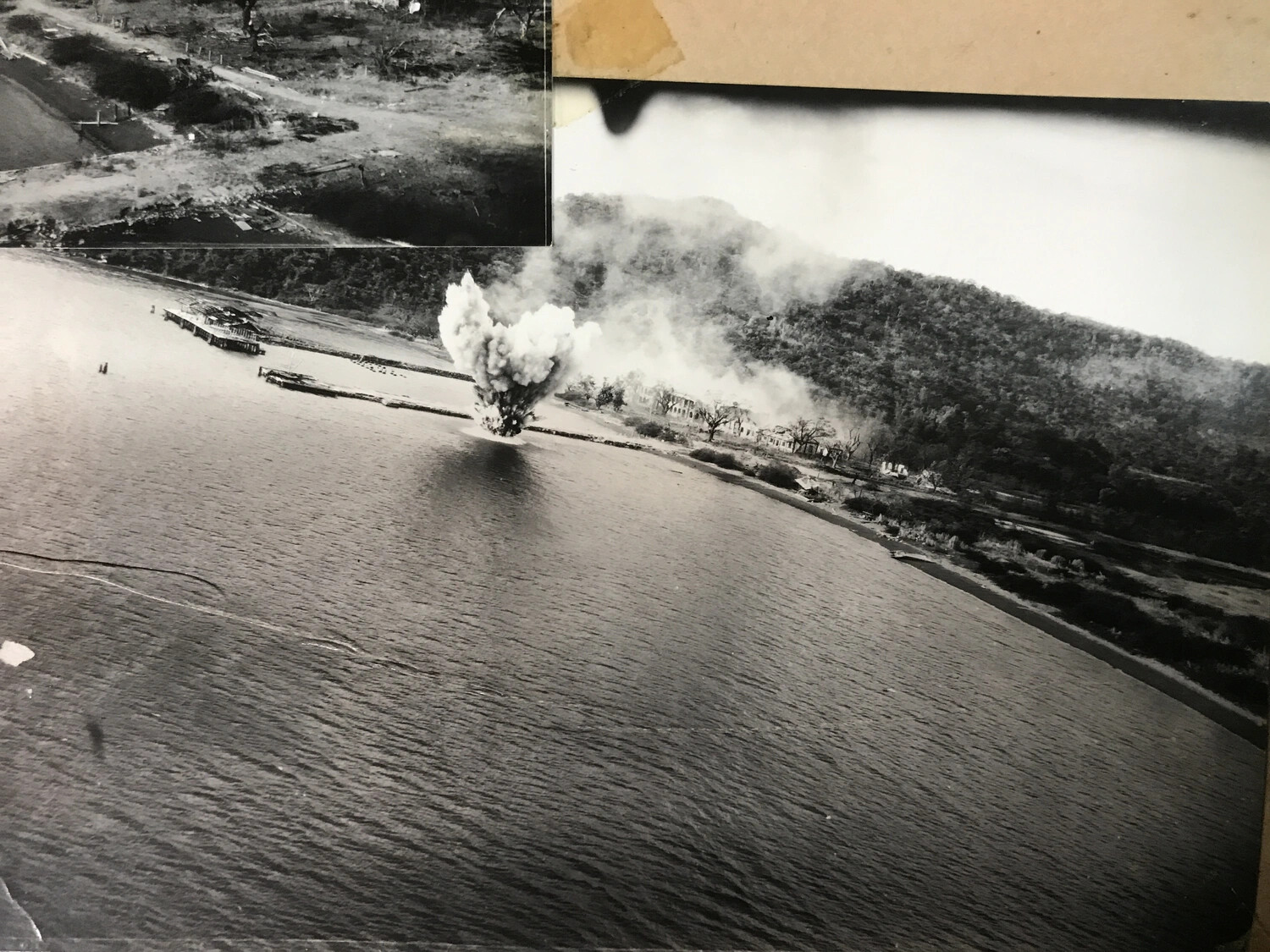 Aerial Strike Photograph: Bomb Burst Near Pier and Coastal Building Complex, Pacific Theater, WWII