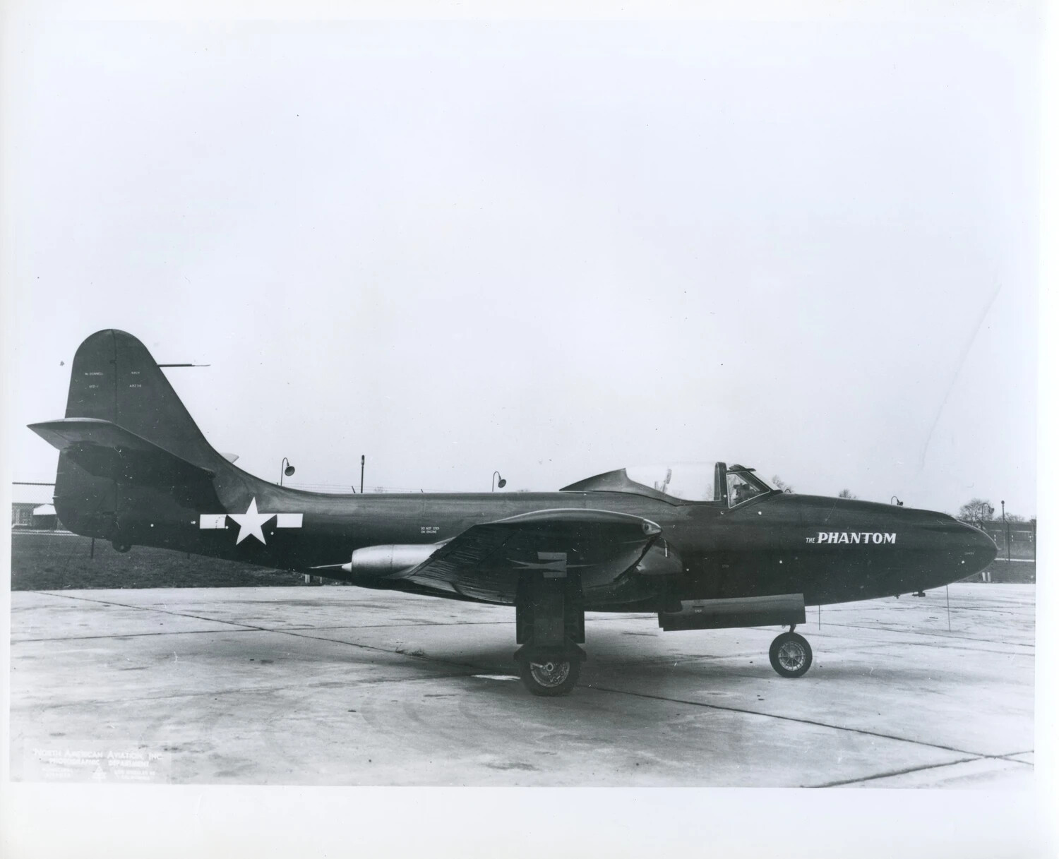 Early U.S. Navy Jet Fighter Named 'The Phantom' on Ramp, Likely McDonnell FH-1 Phantom