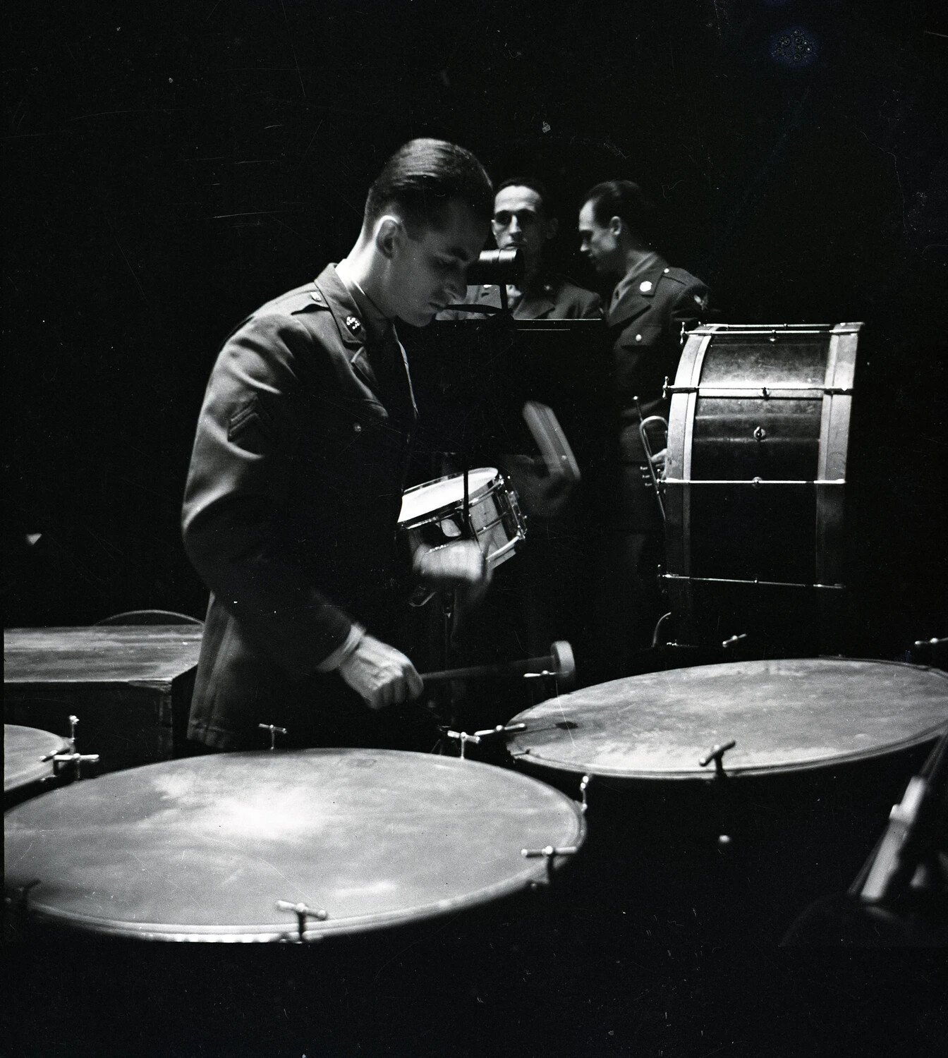 Military Band Percussionist Performing on Timpani During Rehearsal or Concert