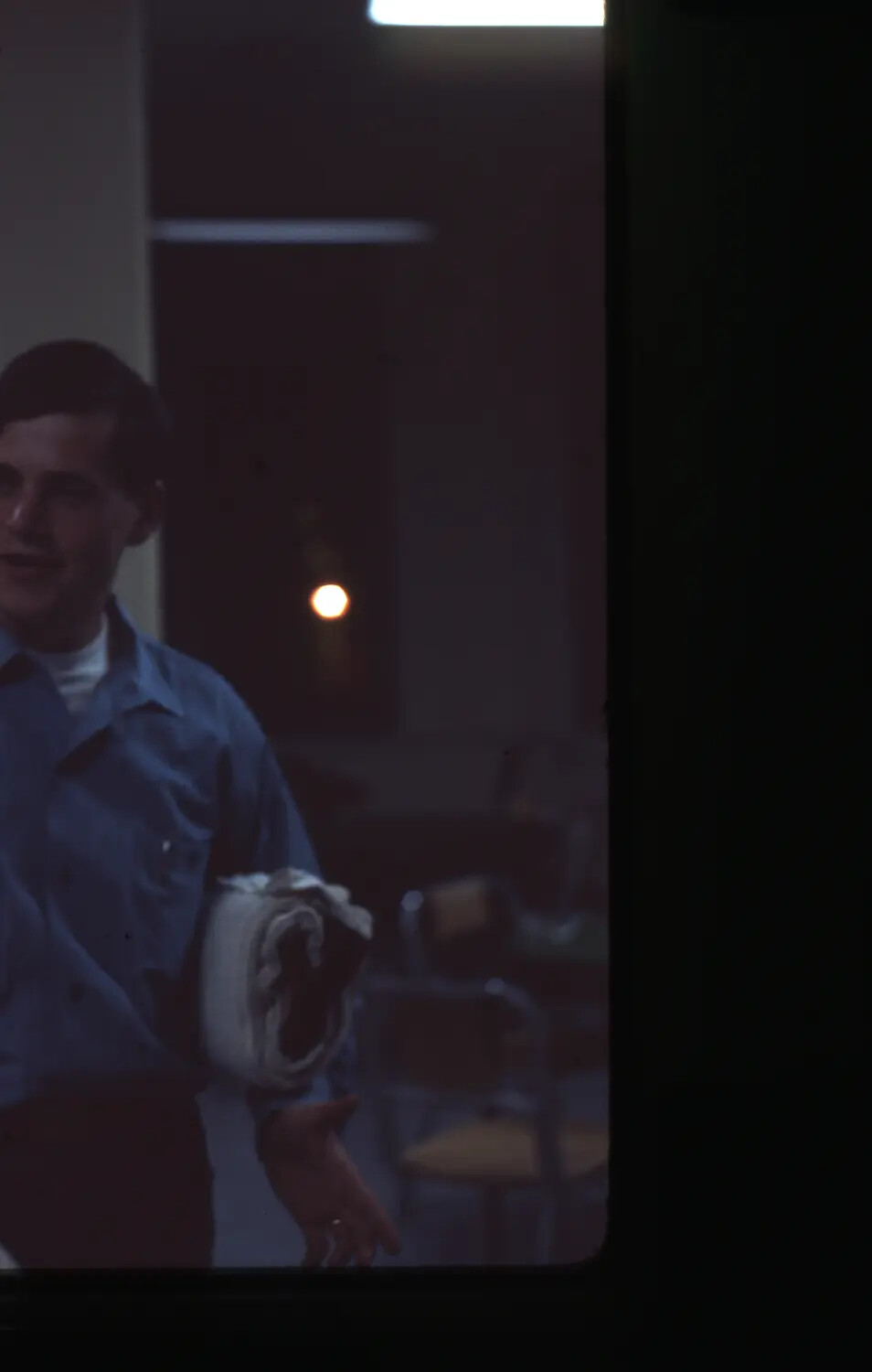 Sailor in Dimly Lit Interior Compartment (Underexposed Slide)