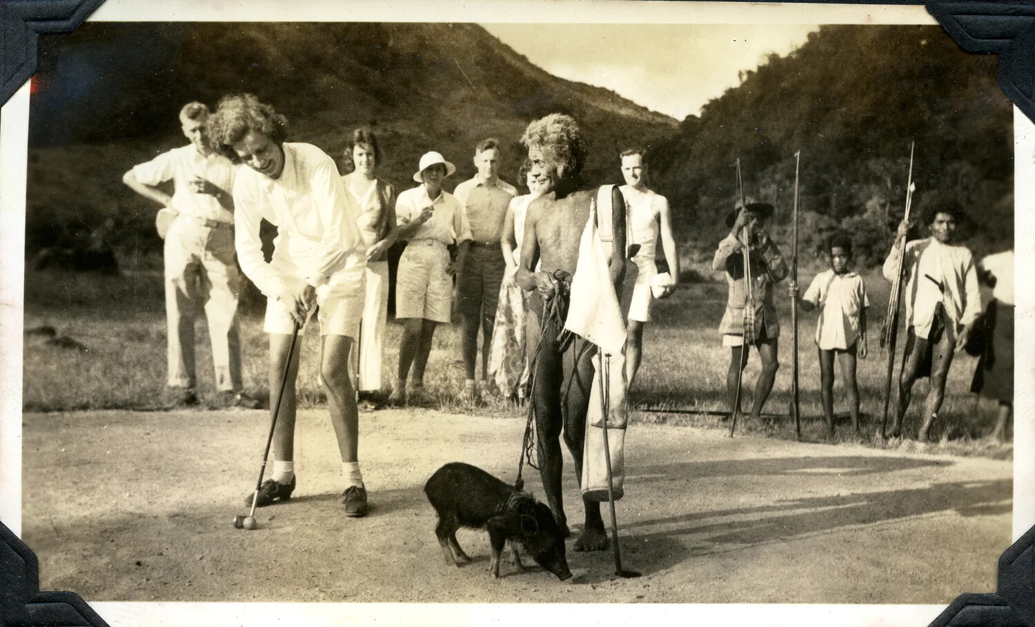 Golf Demonstration with Local Papuan Onlookers, Jervey Signal Corps Photo Album