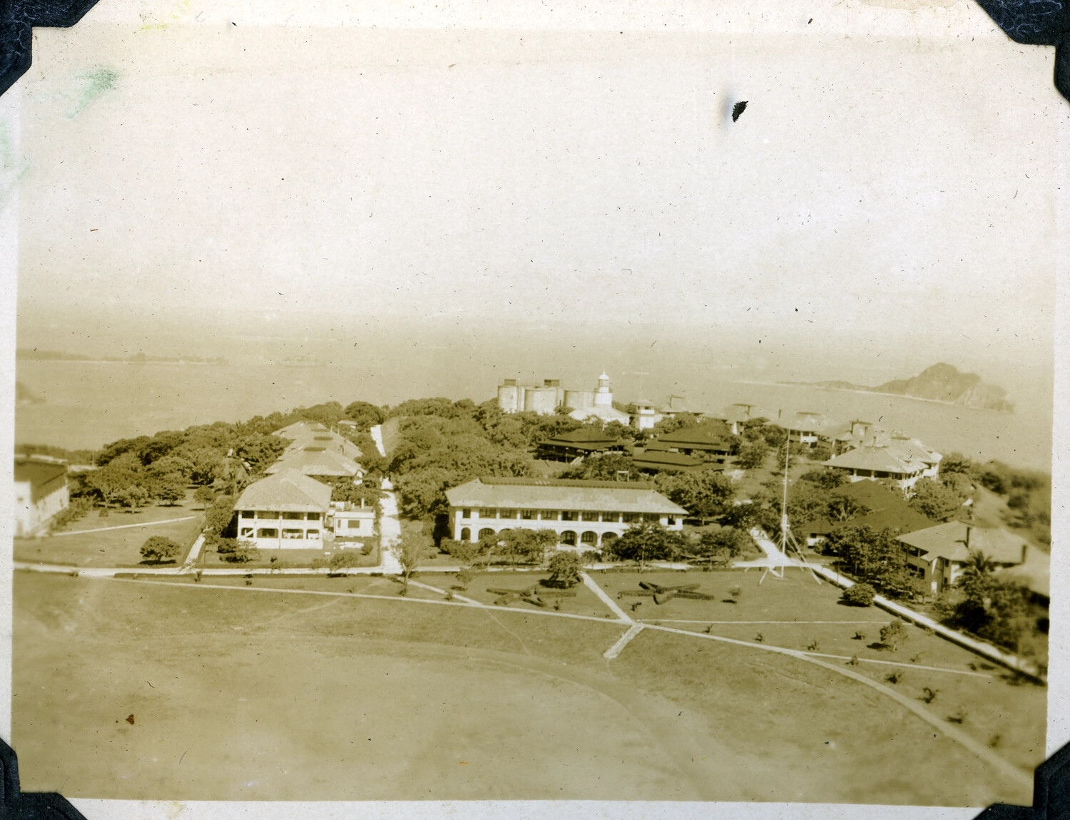 Elevated View of Naval Installation Parade Ground with Flagpole and Artillery Display, Philippines, c. 1920s-1930s