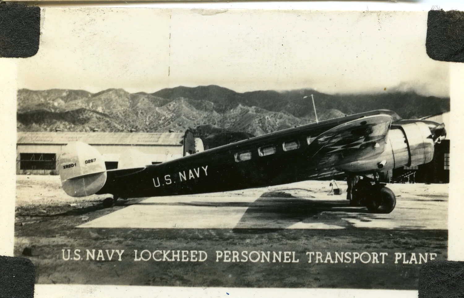 U.S. Navy Lockheed Personnel Transport Aircraft on Airfield Ramp, Pre-WWII/Early WWII Era