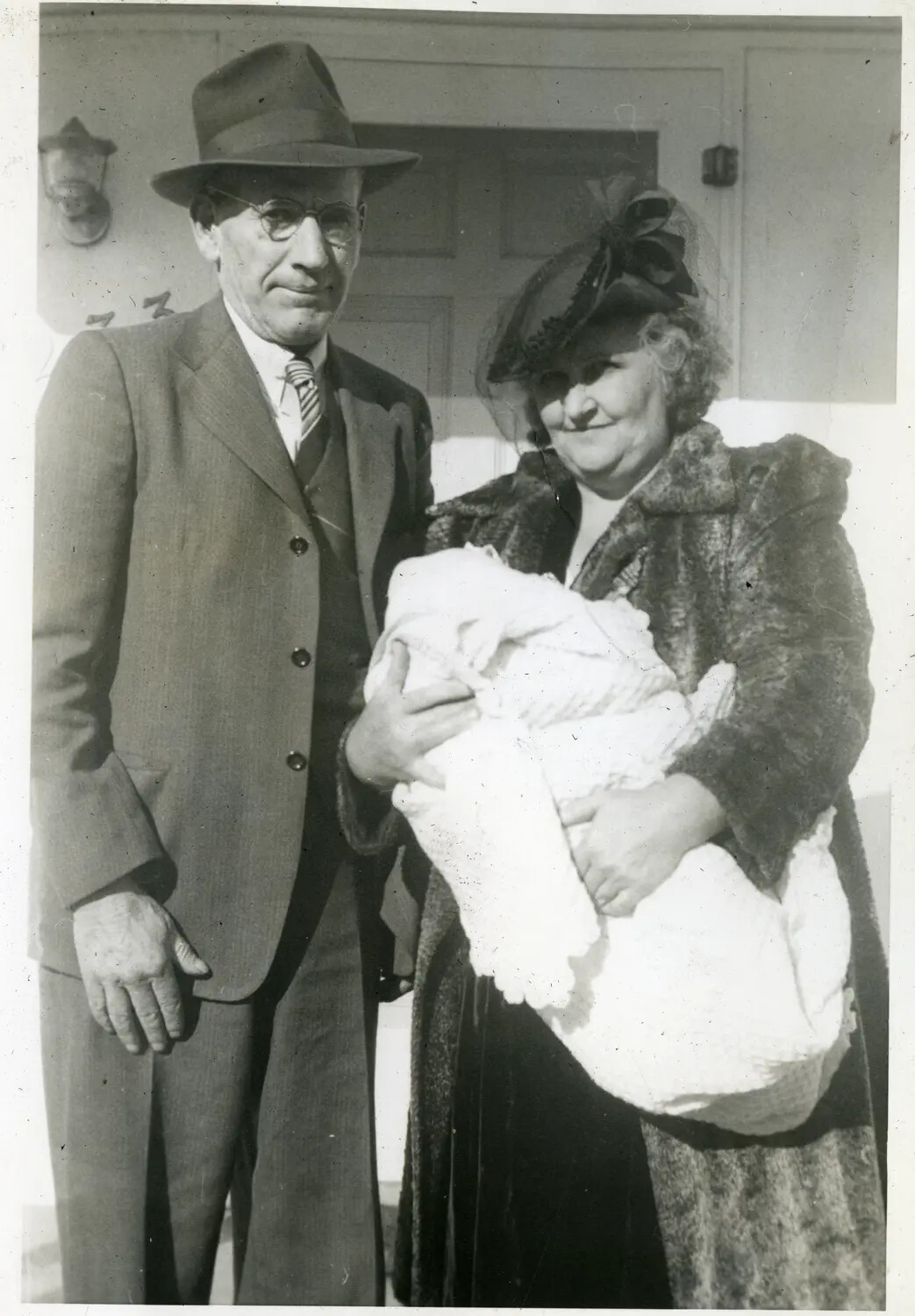 Elderly Couple with Infant in Christening Gown, Family Portrait (1930s USS Maryland Photo Album)