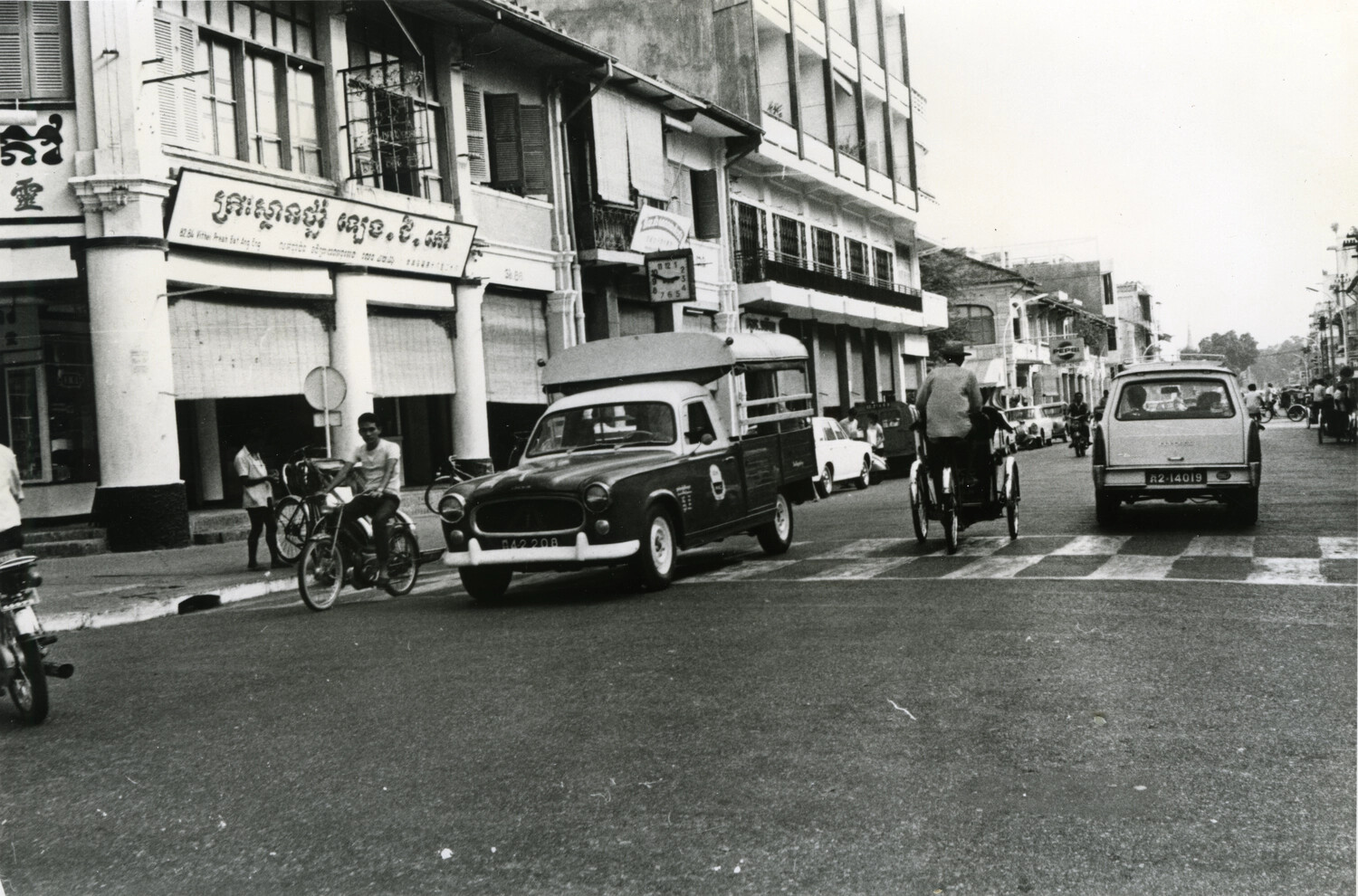 Downtown Street Scene with Traffic and Shophouses, Phnom Penh