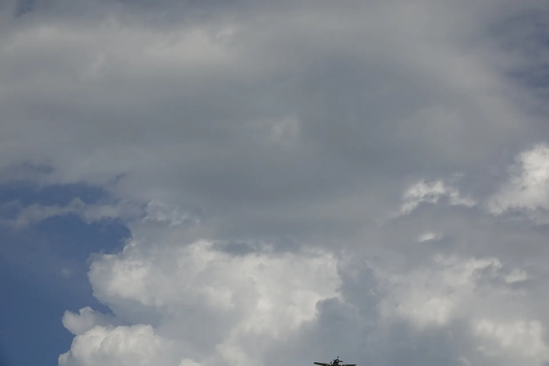 Warbird Aircraft in Flight Against Cumulus Cloud Bank, May 2019 Commemorative Event
