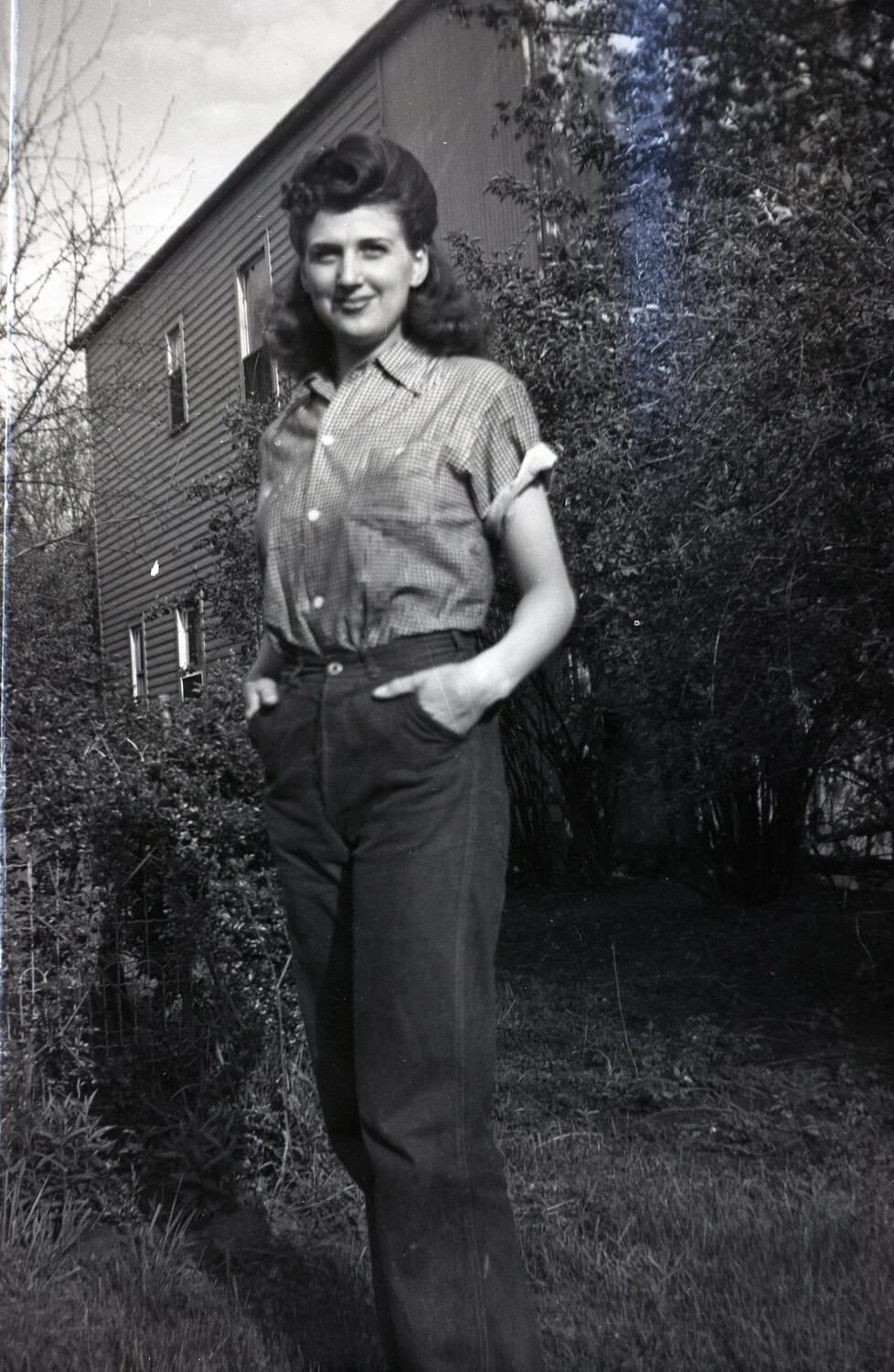Snapshot Portrait: Young Woman in 1940s Attire, Outdoor Domestic Setting (Filed within Military Band Negatives Collection)