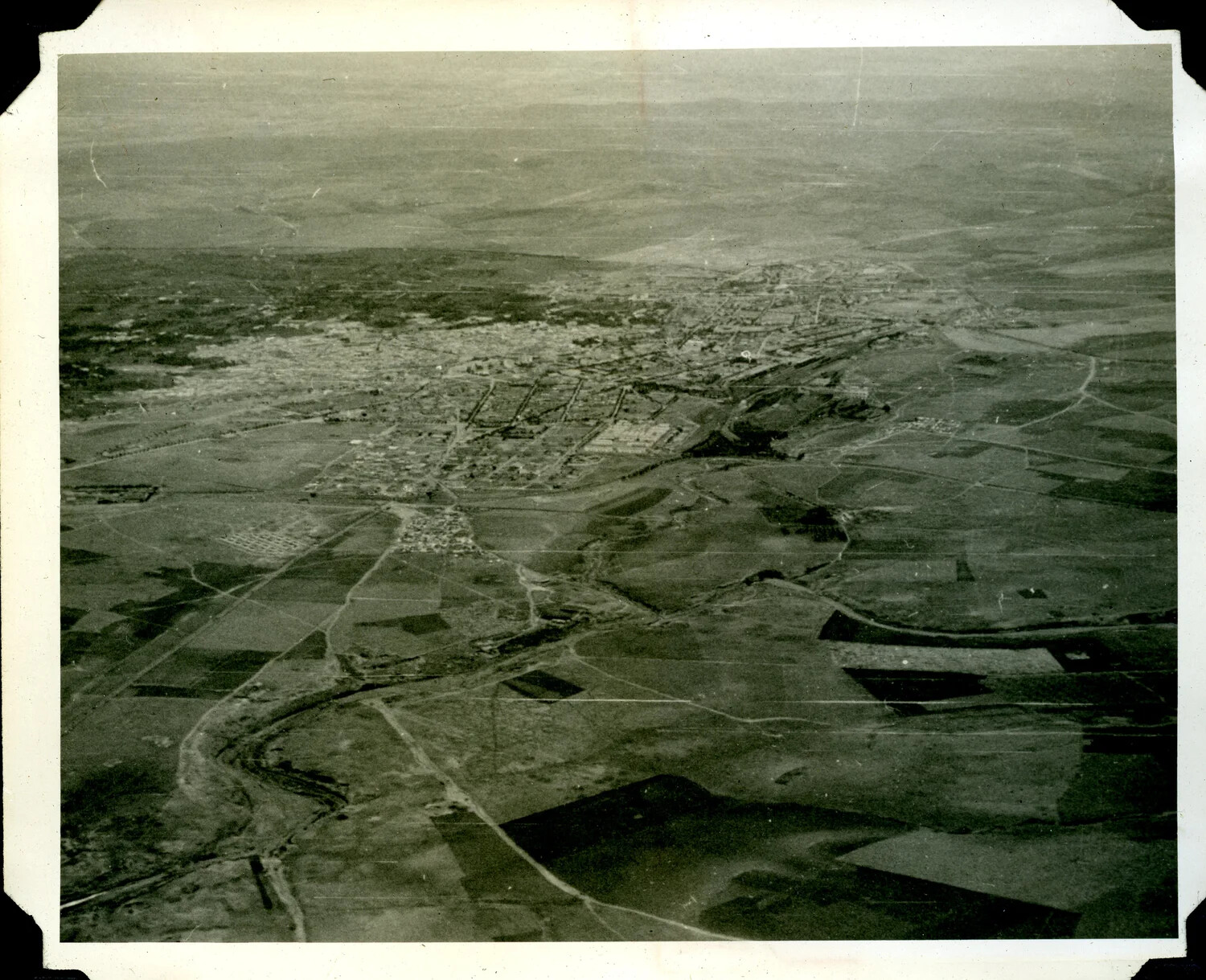 Aerial Reconnaissance Photograph of a Town and Surrounding Agricultural Terrain, WWII Signal Corps Album