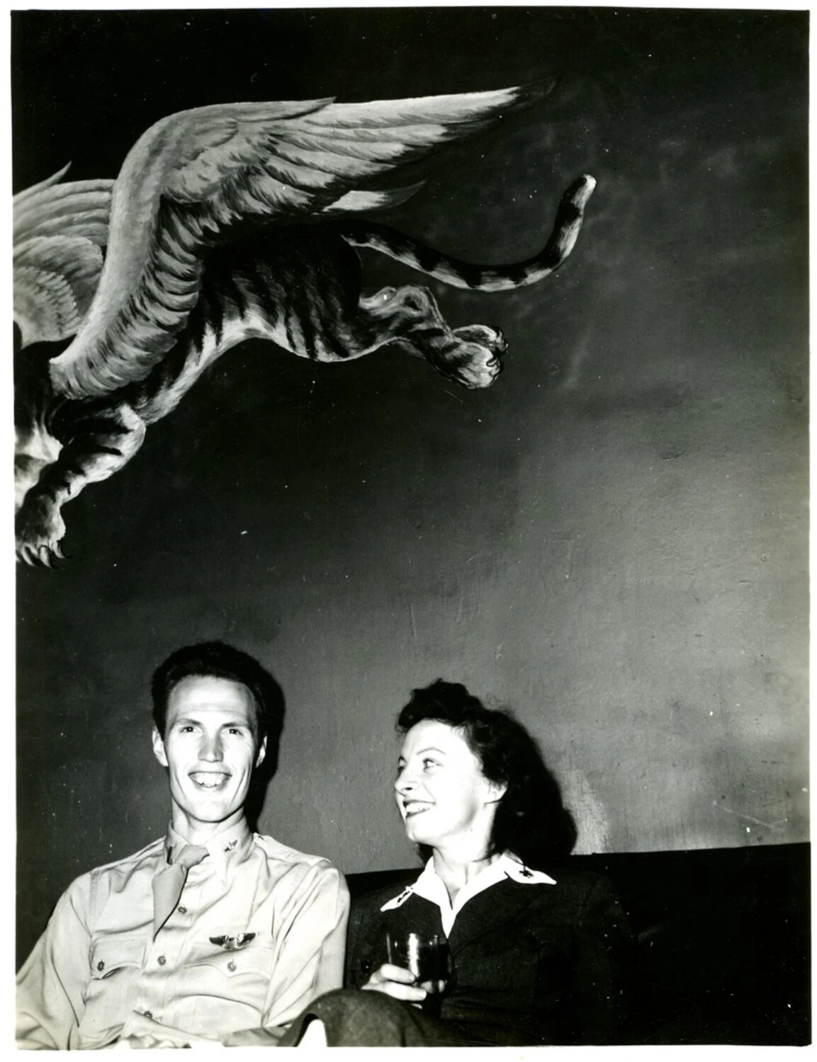 Naval Aviator and Companion Beneath Winged Tiger Mural, WWII-Era Officers' Club