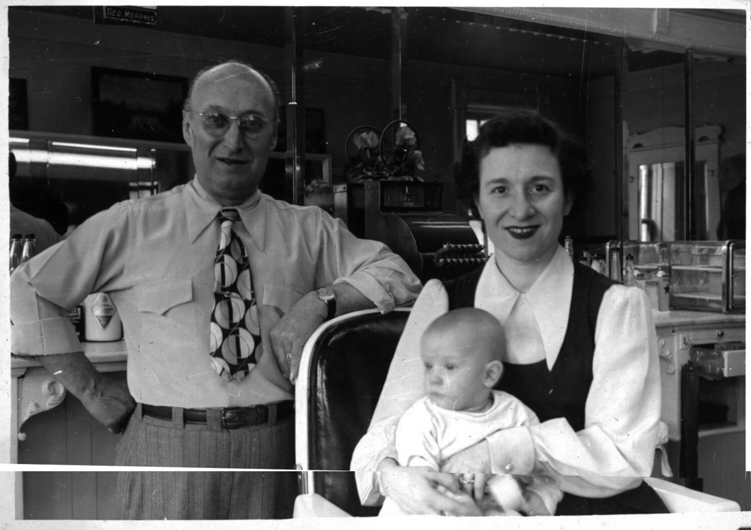 Family Portrait in Barbershop with Infant, Lt. Bancroft Collection, Korean War Era