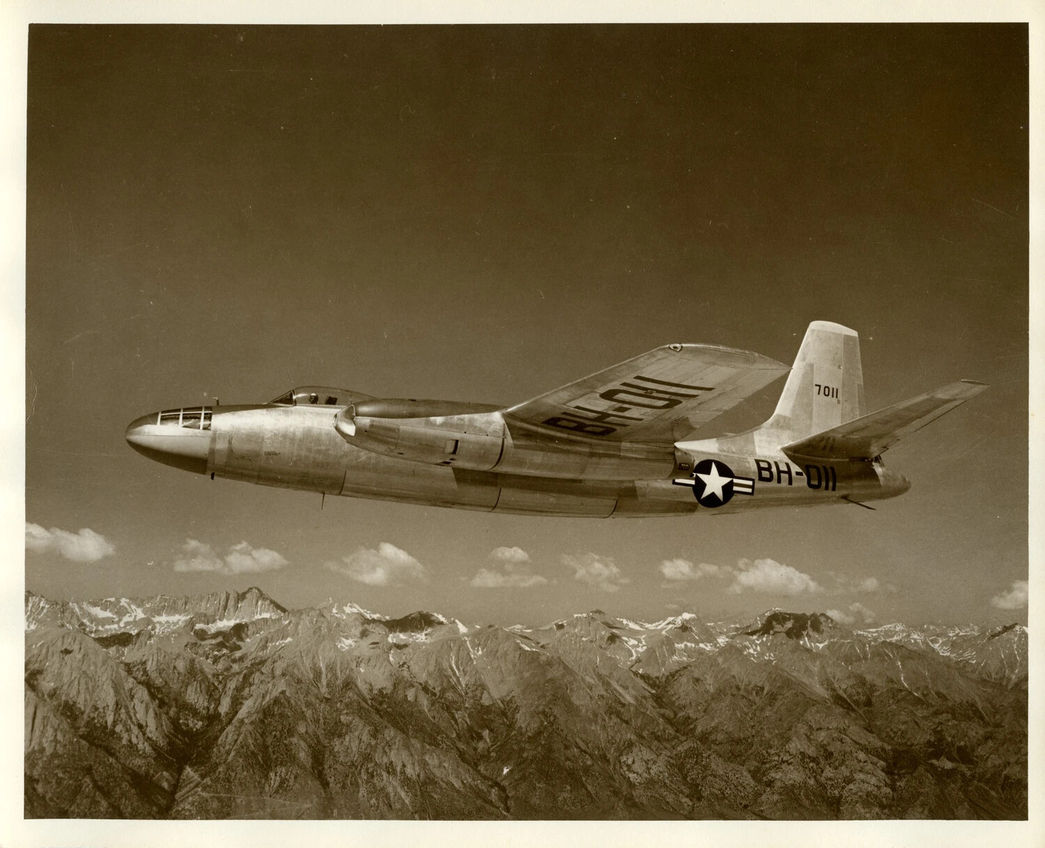 Douglas B-45 Tornado Jet Bomber in Flight Over Mountain Range
