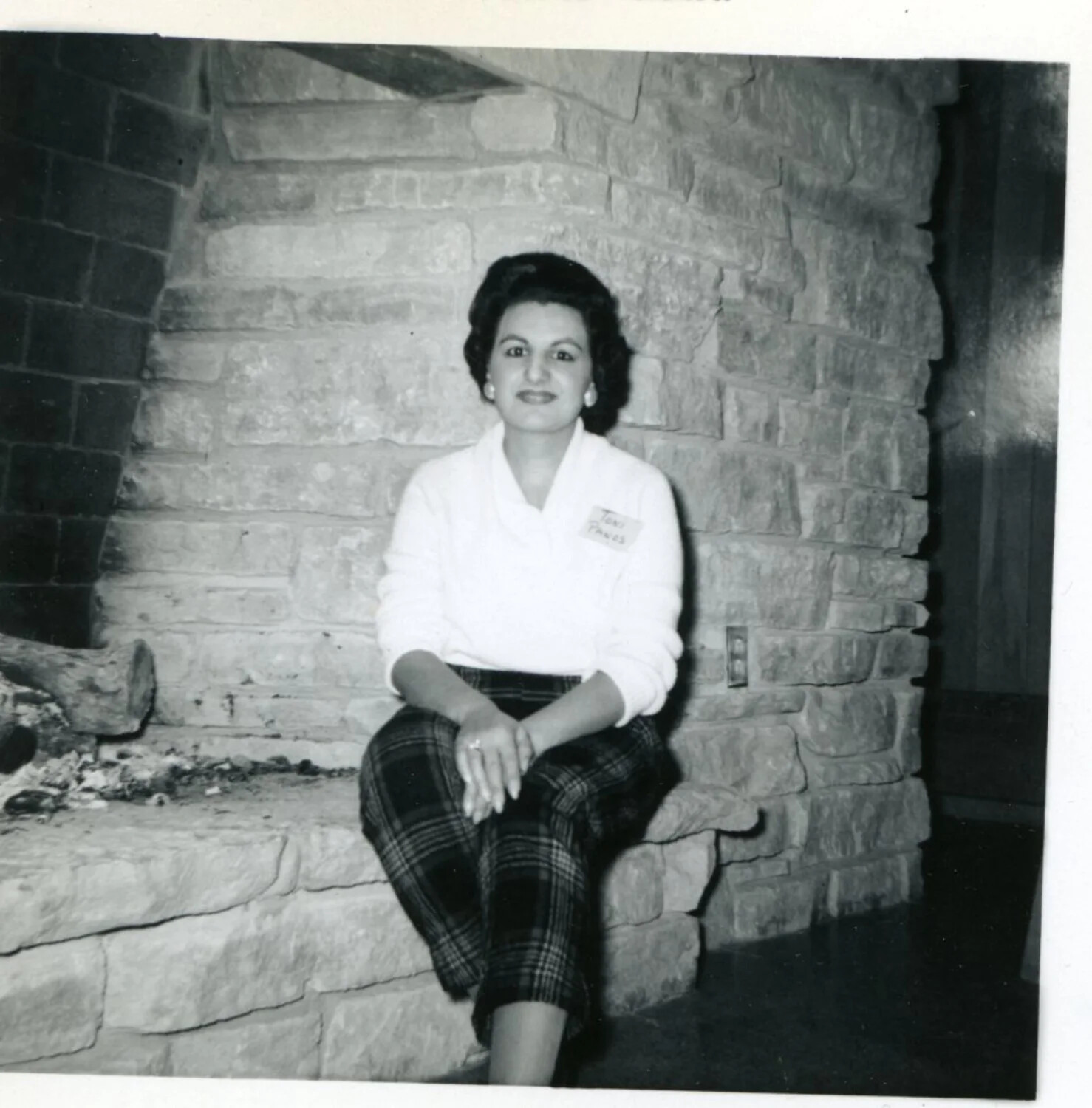 Portrait of a Woman at a Stone Fireplace, Mid-20th Century Domestic Photograph