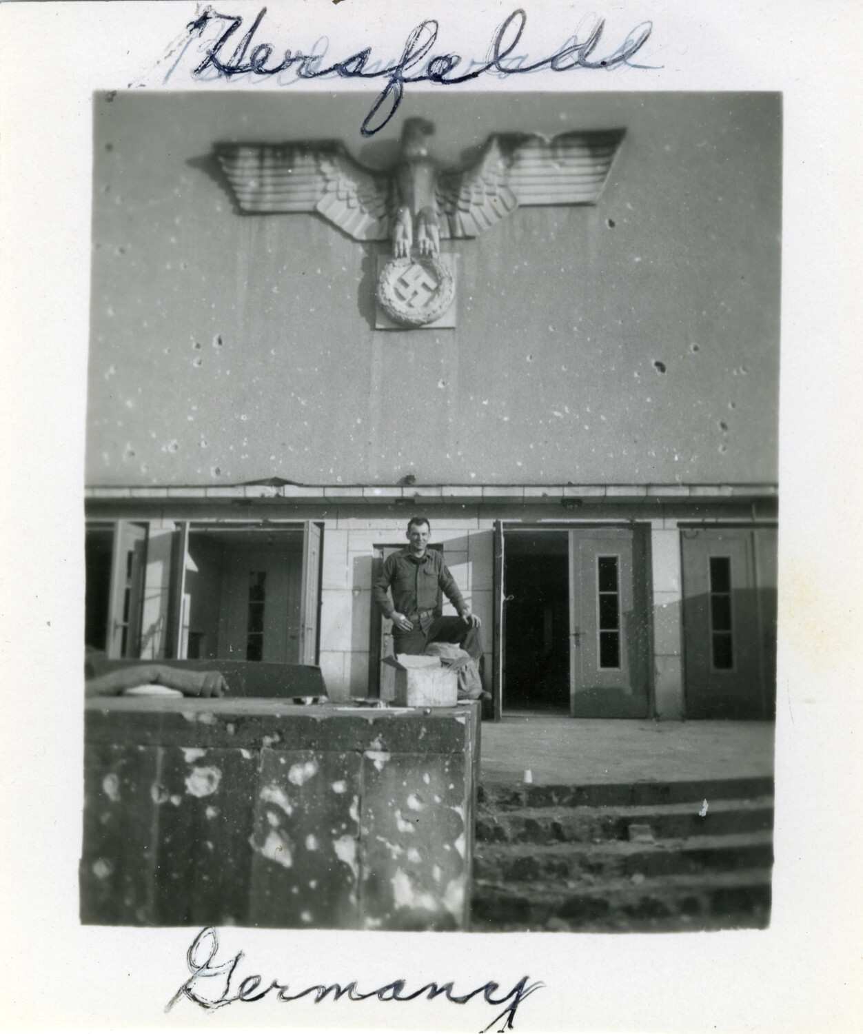 American Soldier at Damaged Nazi Government Building, Bad Hersfeld, Germany, 1945