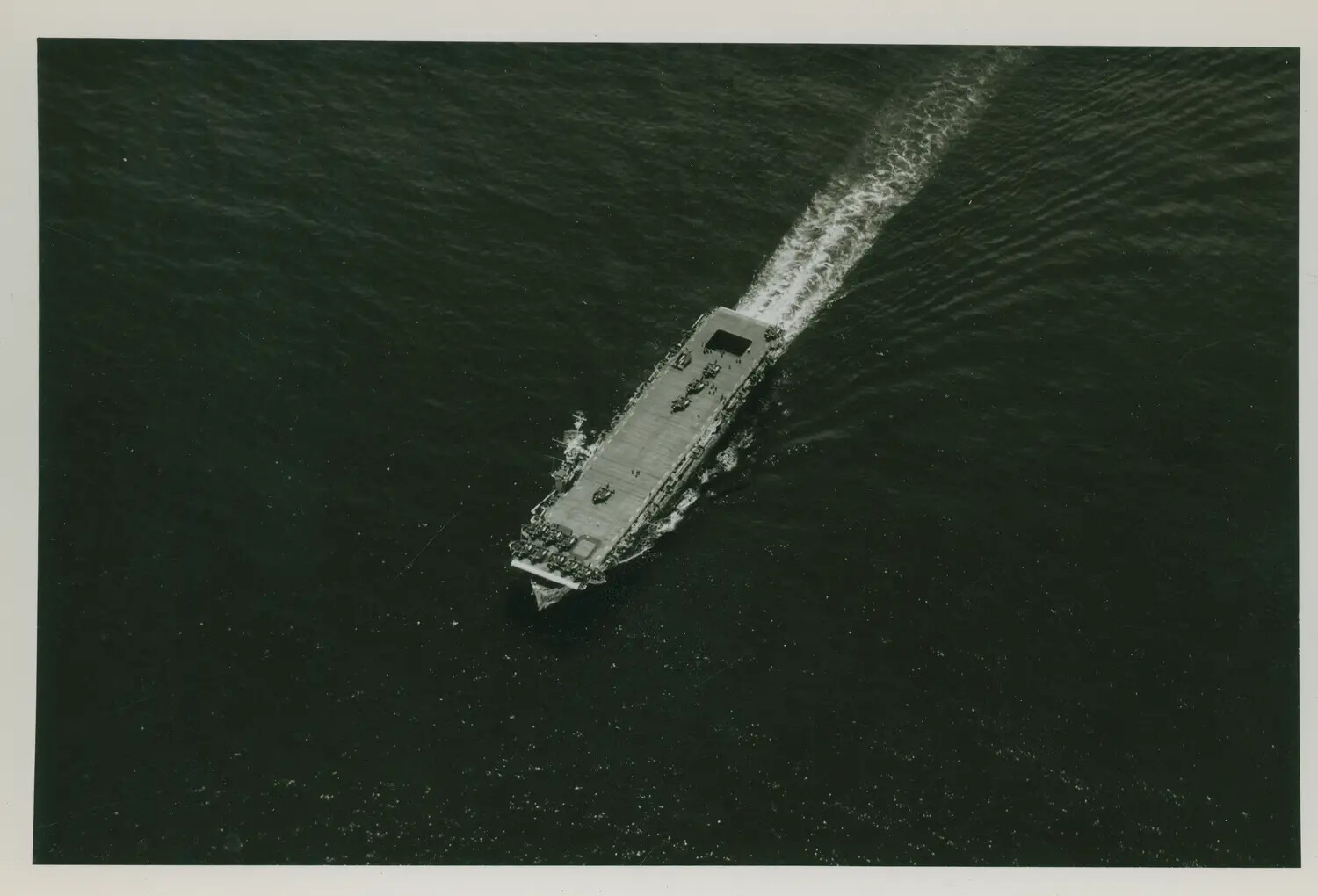 Aerial Overhead View of Escort Carrier Underway, Possibly USS Petrof Bay (CVE-80), WWII Pacific Theater