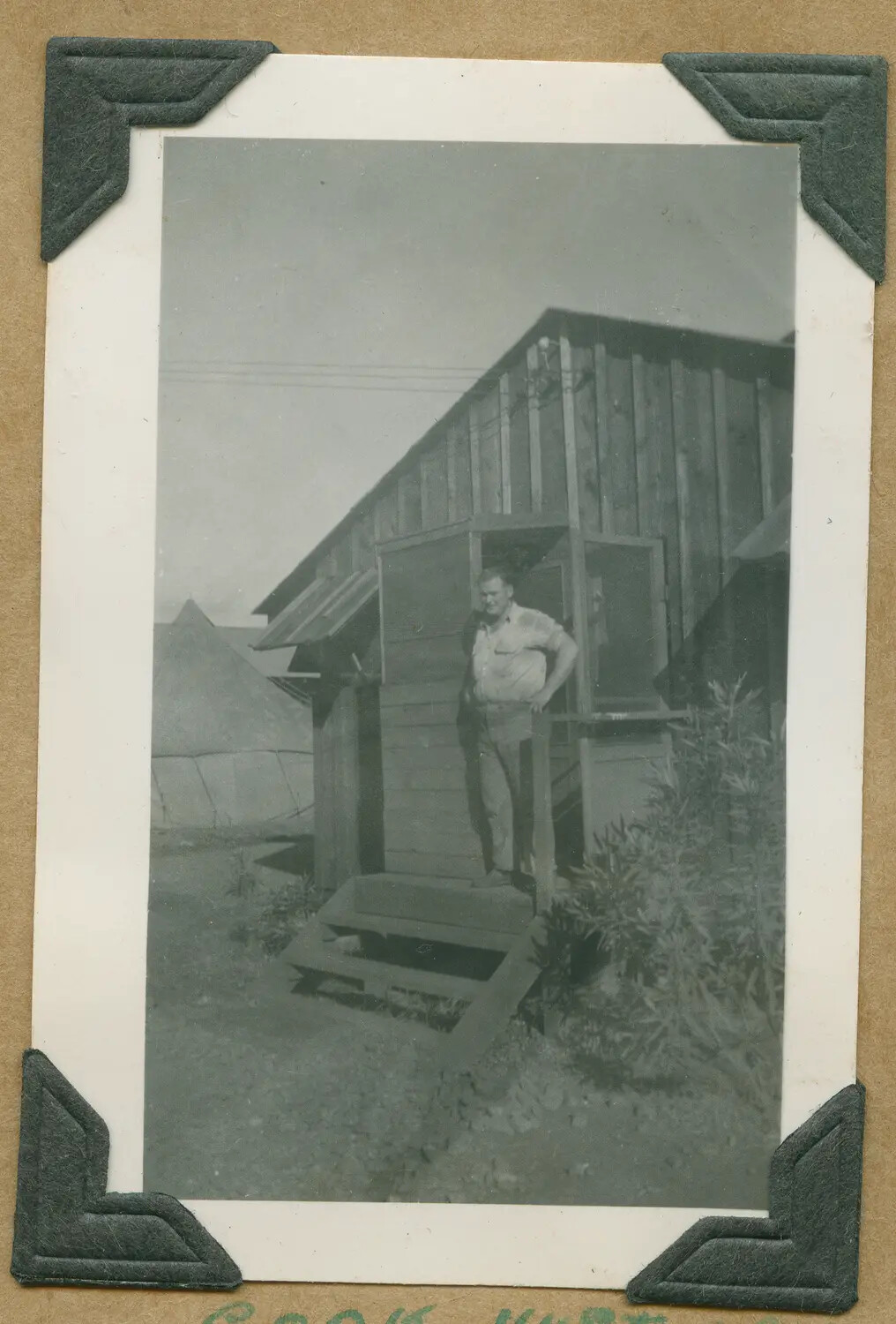 Serviceman Standing at Doorway of Camp Cook Hut, Hawaii, WWII Era