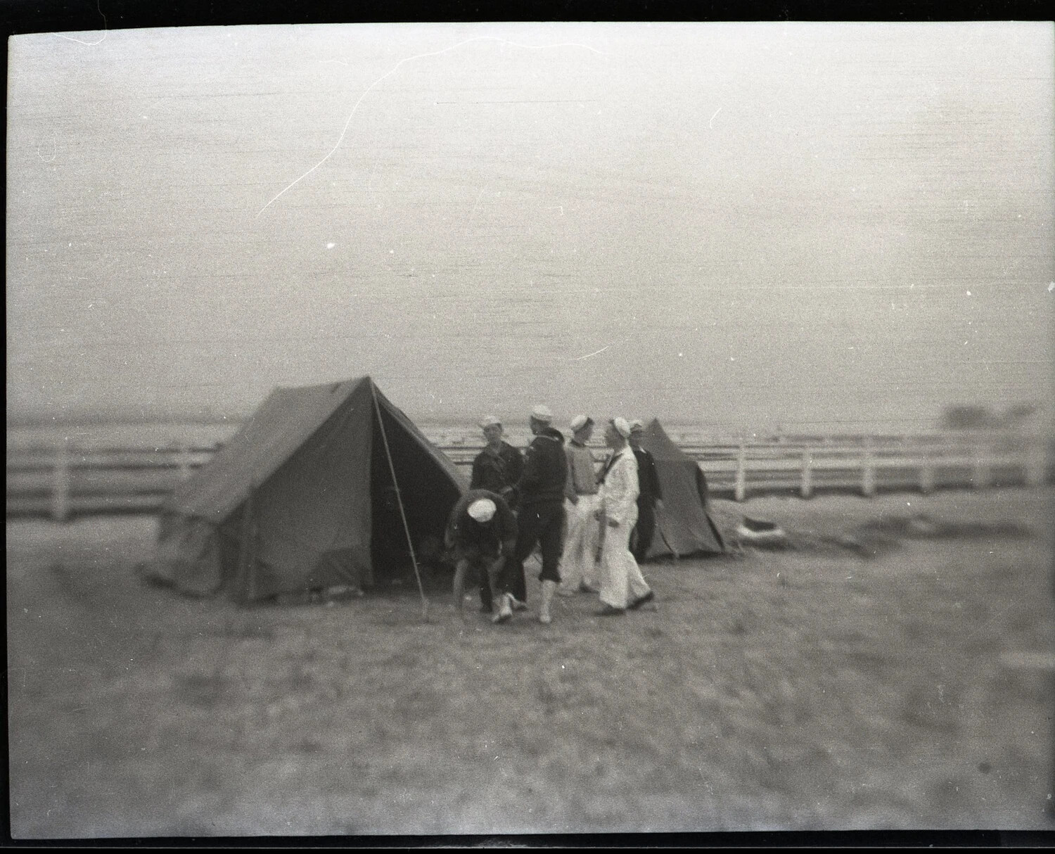 Group Beside Pitched Tents Near Coastal Field, State-Side, WWII Era
