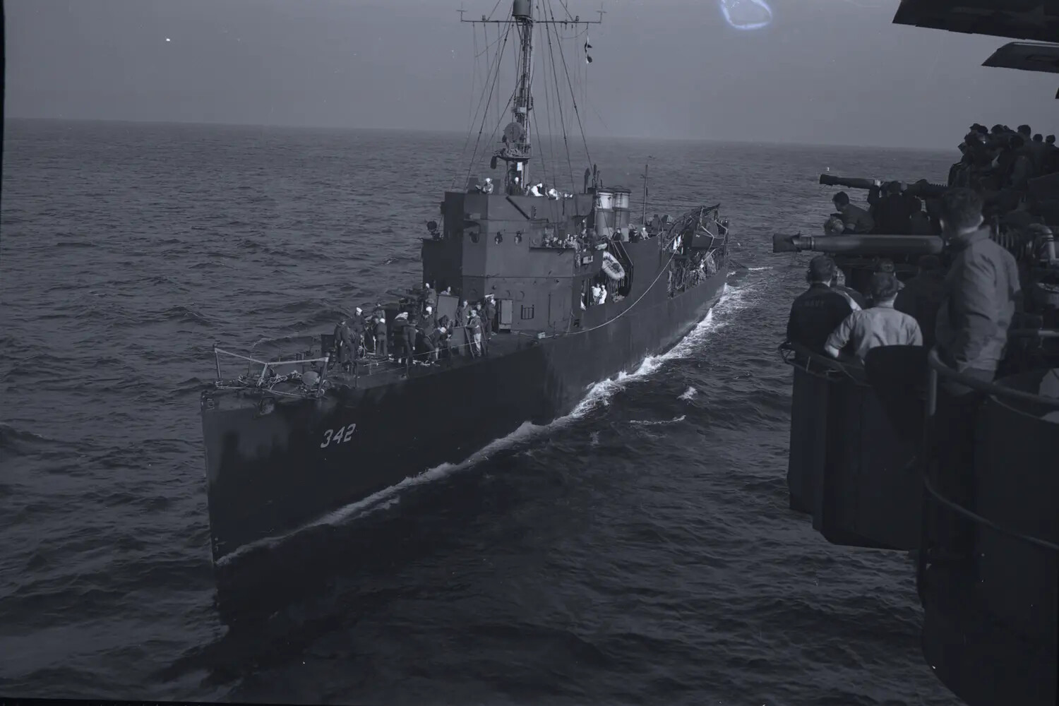 Destroyer Escort DE-342 Alongside USS Petrof Bay (CVE-80) During Underway Transfer, WWII Era