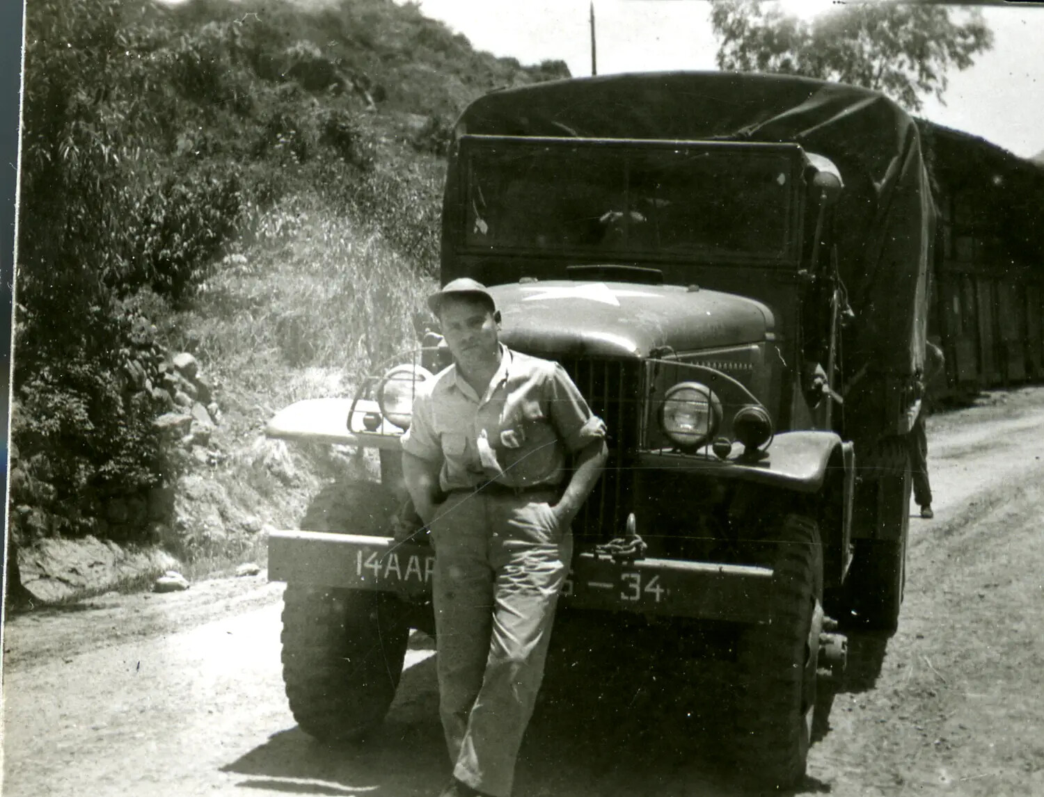 Serviceman with 14th Air Force Cargo Truck on Mountain Road, China-Burma-India Theater, WWII
