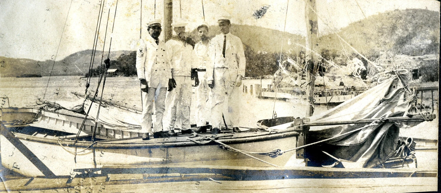 Four US Navy Sailors Aboard a Ship's Sailing Launch at Anchorage, USS Columbia Album
