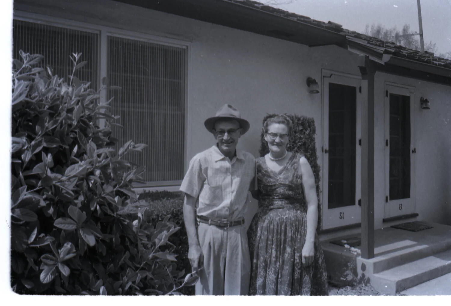 Couple Posing Outside Residential Courtyard Apartment, 1958