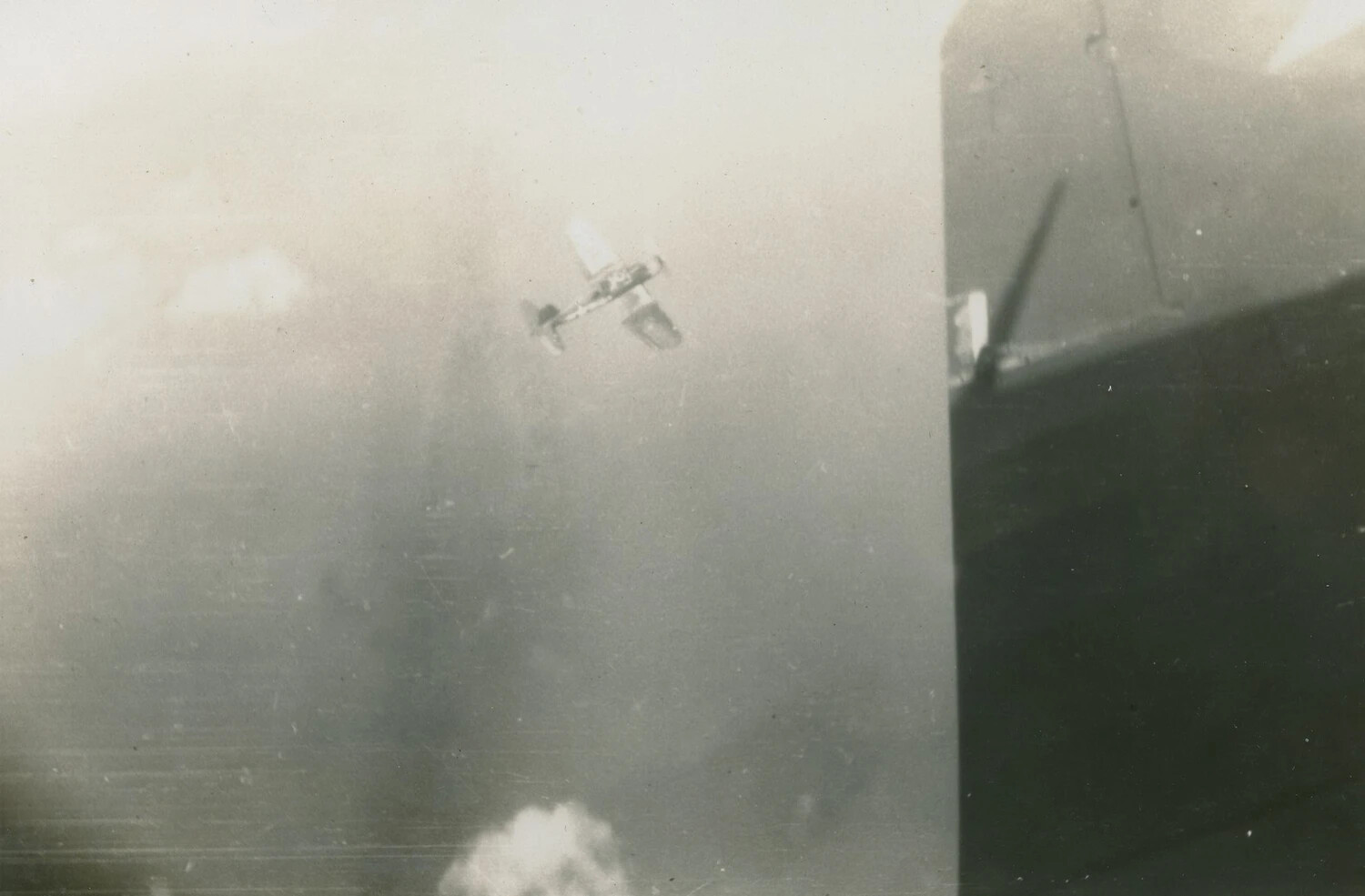 In-Flight Photograph of Gull-Wing Fighter Aircraft, Possible WWII Pacific Theater Operation