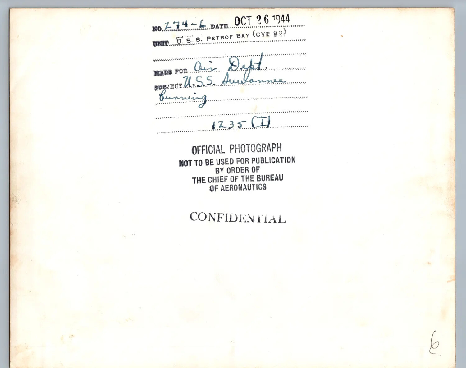 Verso Caption Card, USS Petrof Bay (CVE-80) Official Photograph No. 274-6, 'USS Suwannee Burning,' 1235, October 26, 1944