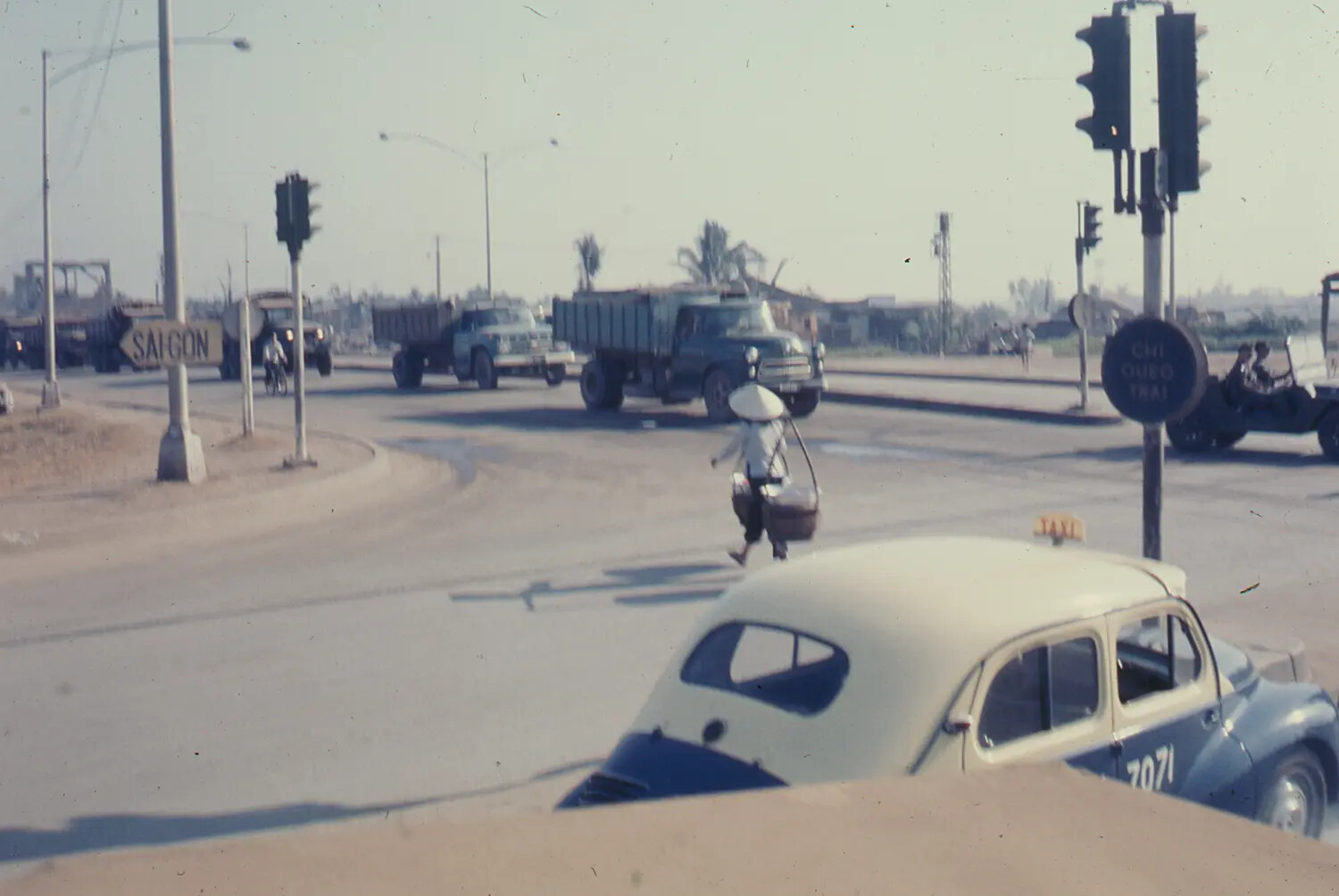 Civilian and Military Traffic at a Saigon Street Intersection, South Vietnam, 1968 (Tet Offensive Period)