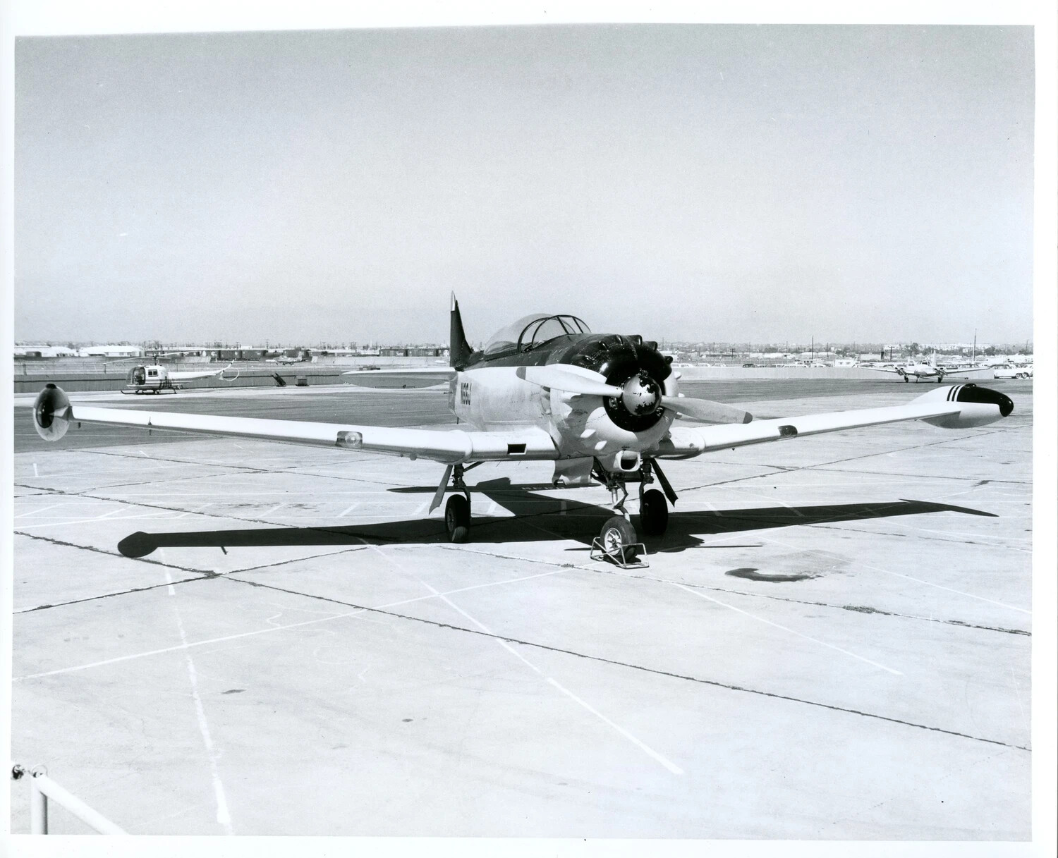 USAF Single-Engine Trainer Aircraft on Airfield Ramp (Likely North American T-28 Trojan)