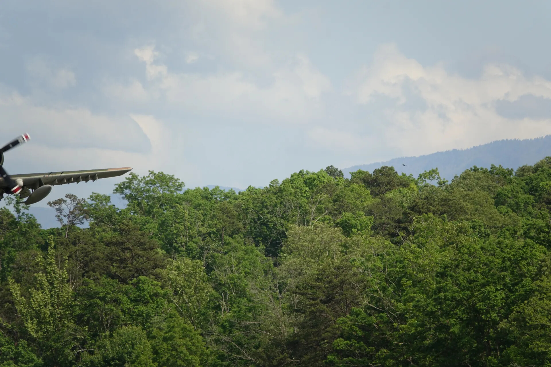 Aircraft Wing and Propeller Spinner over Forested Ridge, May 2019 Reunion Event
