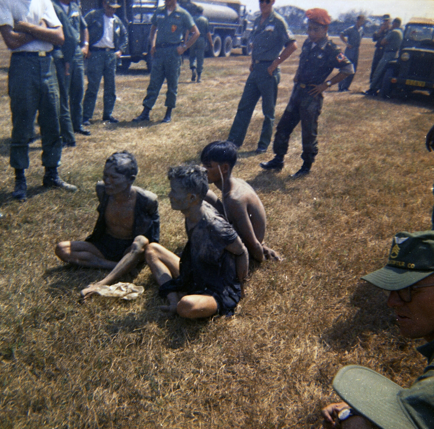 ARVN Airborne Officer and U.S. Advisors Overseeing Detainees, South Vietnam, 1963