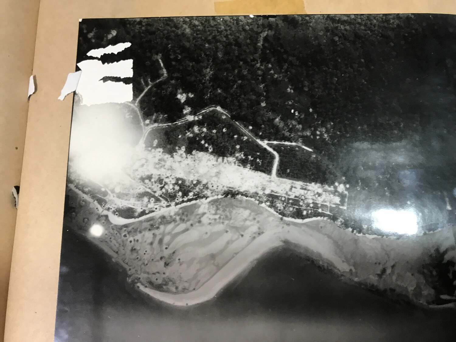 Aerial Reconnaissance Photograph of Coastal Village and Shoreline, New Guinea