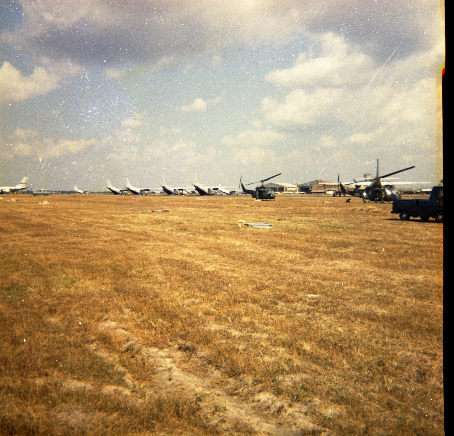 Airfield Flight Line with Helicopters and Transport Aircraft, Vietnam, 1963