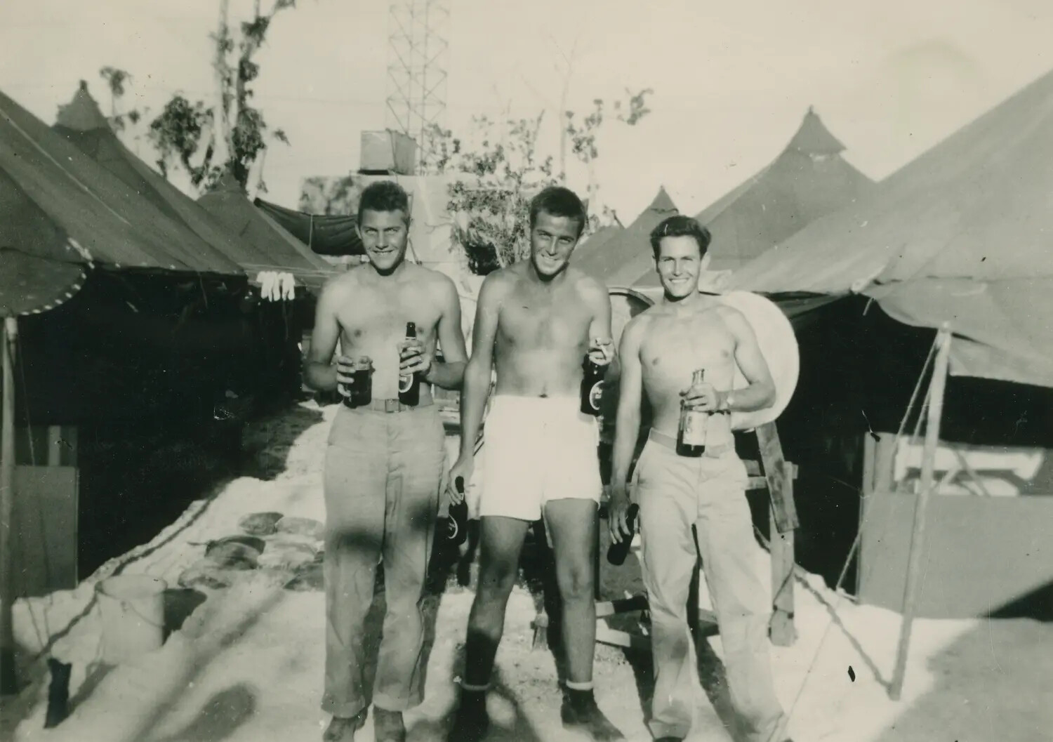 Three Off-Duty Servicemen with Beer Bottles at Tent Camp, WWII Pacific Theater, McAleer Collection