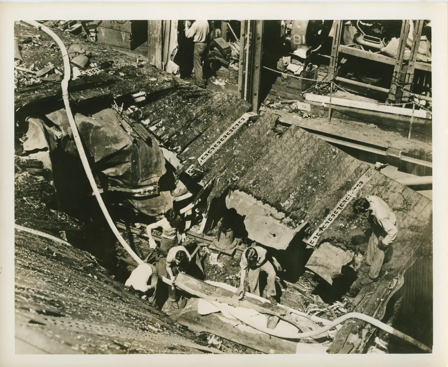 Damage Control Crew Clearing Torn Flight Deck Plating After Battle Damage, Escort Carrier, World War II Pacific Theater