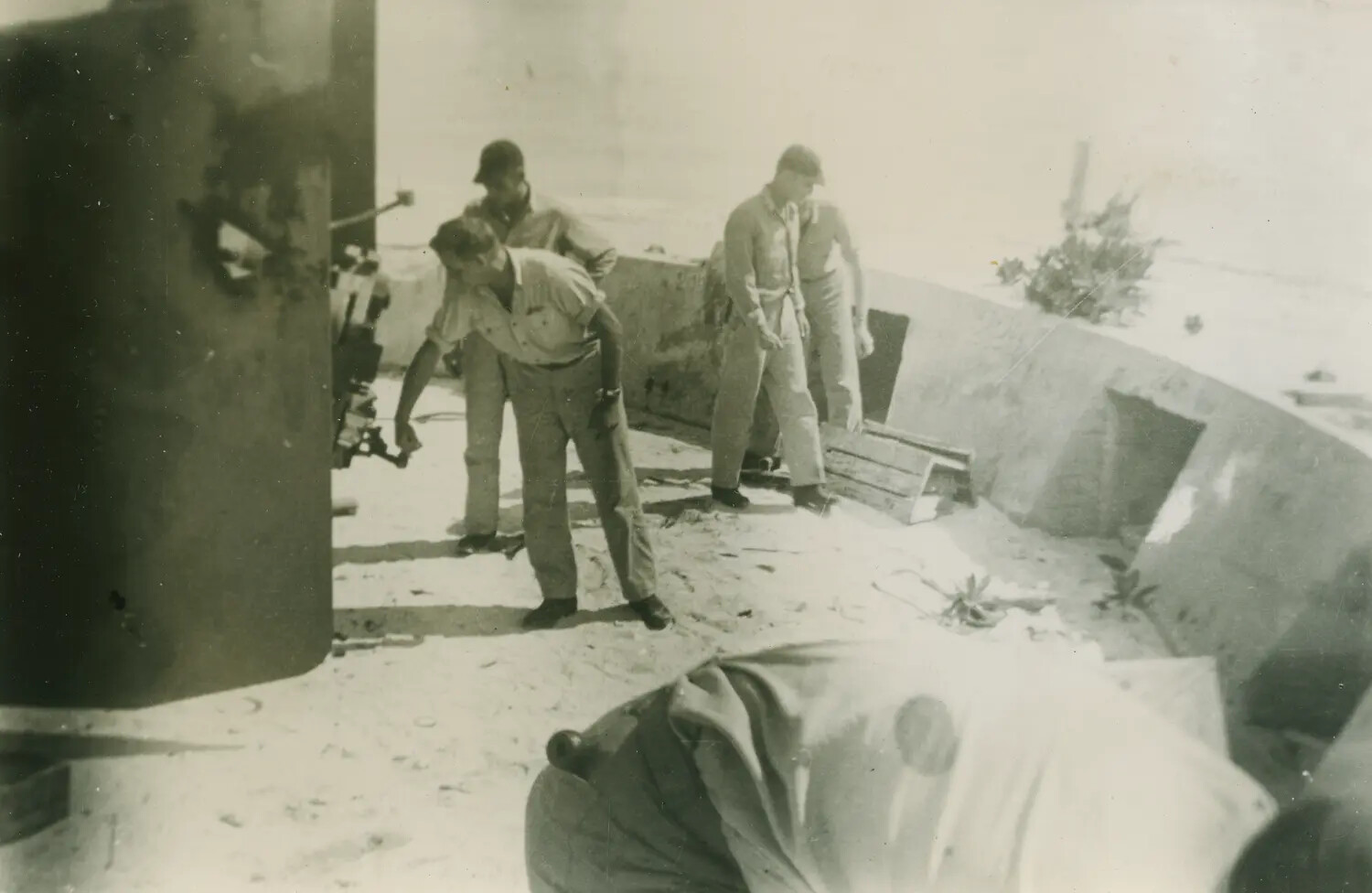 Sailors Inspecting Deck Equipment Aboard a Naval Vessel, WWII Era
